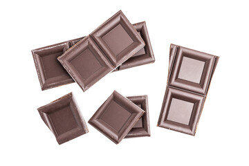 Dark chocolate pieces, cubes, broken chocolate isolated on white background, top view