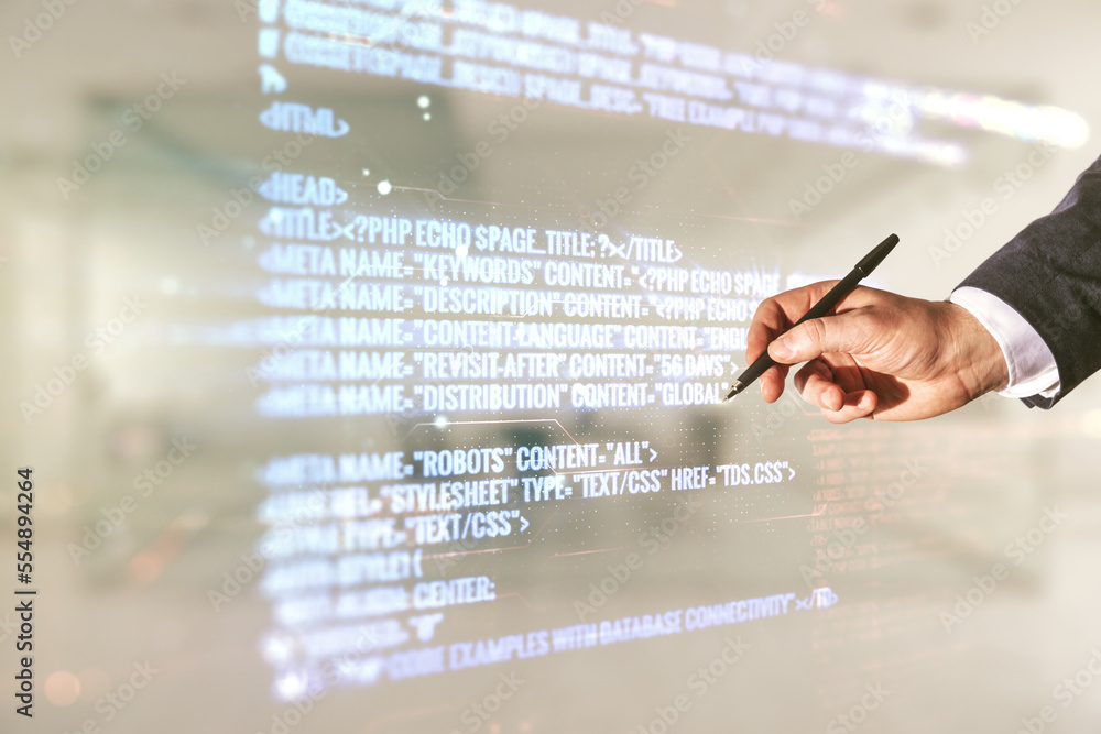 Poster double exposure of male hand with pen working with abstract programming language interface on blurre