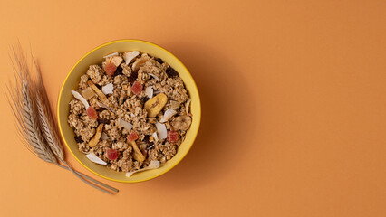 Granola with dried fruits on bowl