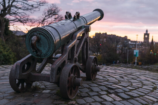 Old cannon installed on pavement