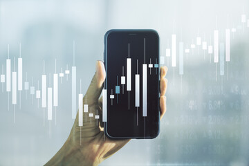 Multi exposure of abstract creative financial graph and hand with phone on background, forex and investment concept