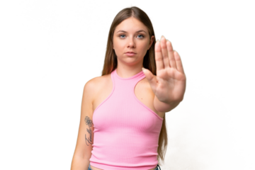 Young beautiful blonde woman over isolated background making stop gesture