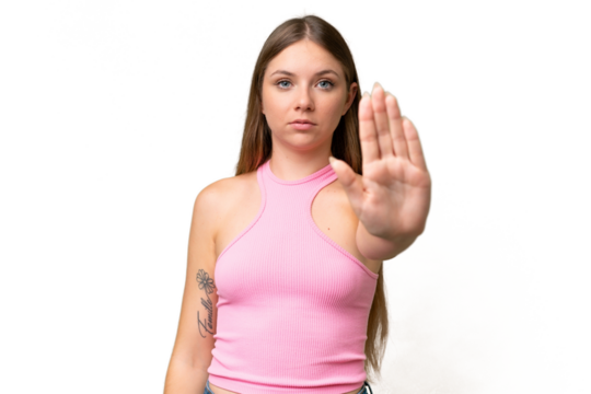 Young beautiful blonde woman over isolated background making stop gesture