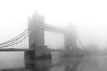 Tower Bridge London in fog in black and white in Great Britain Europe