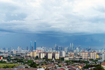 Fototapeta na wymiar View of cumulus clouds over down town Kuala Lumpur, Malaysia.