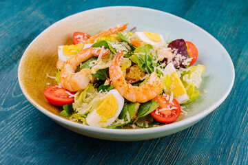 Fresh salad with vegetables and seafood