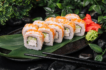 Fresh sushi rolls with shrimp on stone plate