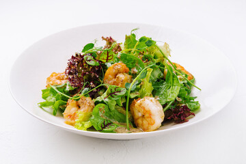 Prawn salad on white plate isolated