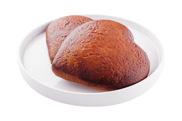 Closeup of two of heart-shaped cookies on plate