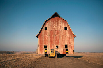 Barn being moved on a dirt road in the countryside; Dunbar, Nebraska, United States of America