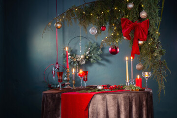 red  and golden christmas decor on table on dark background