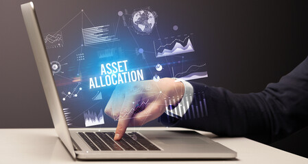 Businessman working on laptop, business concept