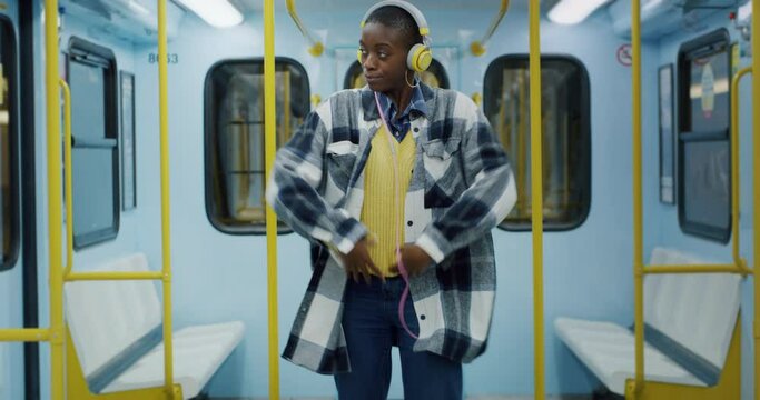 Young Black Woman Dancing in Subway
