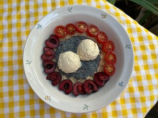 Greek yogurt with over night oat milk and cherry and little tomato