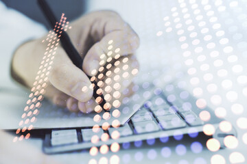 Double exposure of creative abstract upward arrows hologram and hand writing in notebook on background with laptop. Ambition and challenge concept