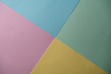 Abstract geometric paper is colorful background. Blue, pink, green and yellow trend colors....