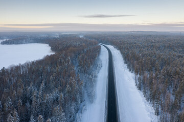 Winter highway in the forest area top view