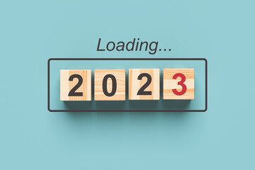 2023 new year loading. Wooden cubes with 2023 on a blue background. 3d rendering.