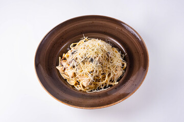 pasta with mushrooms, chicken meat and cheese on a white background