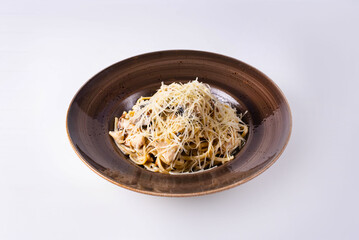 pasta with mushrooms, chicken meat and cheese on a white background