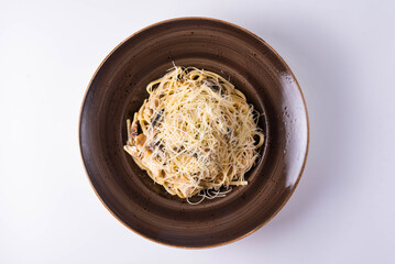 pasta with mushrooms, chicken meat and cheese on a white background