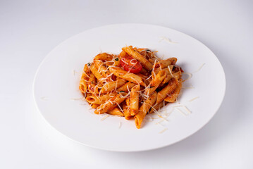 macaroni in sauce with cheese on a white background