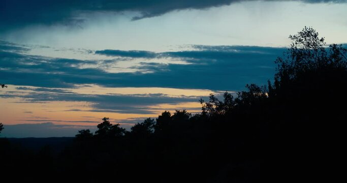 Sunset timelapse on nature floating clouds at evening sky