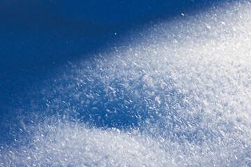 prestine white snow surface with ice cristalls for a background