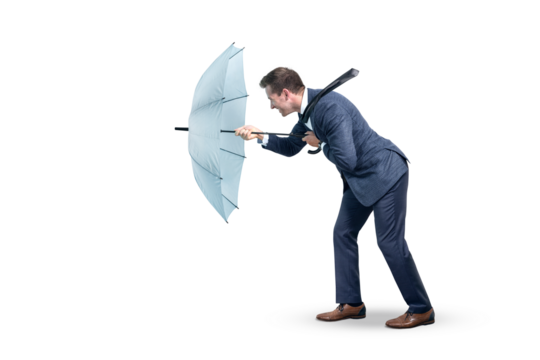 Businessman withstanding strong headwind
