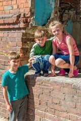 Three children in a destroyed house are hiding from military conflicts, refugee children have...