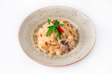 pasta with mushrooms, chicken meat, sprinkled with cheese on a white background