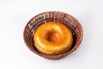 bread, flatbread in a wicker round basket on a white background