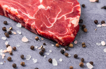 Fresh beef steak on a concrete background