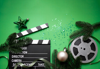 
christmas movie night concept. New Year's decorations, film reel, clapperboard and confetti...