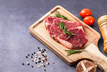 Fresh beef steak on a concrete background