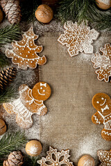 Christmas ginger cookies. Still life with spruce cones and branches and copy space