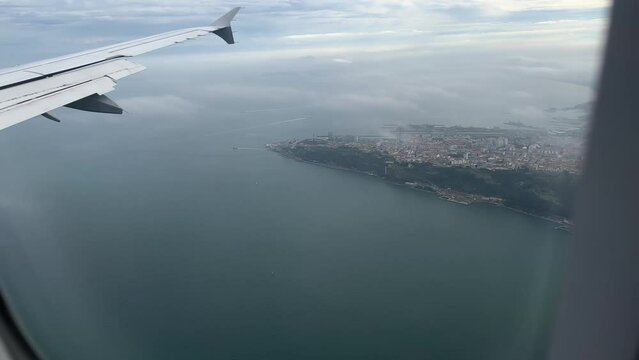 View from window of airplane landing in Lisbon in December