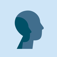 Psychology of personality disorders concept. Male silhouette with two faces on a blue background