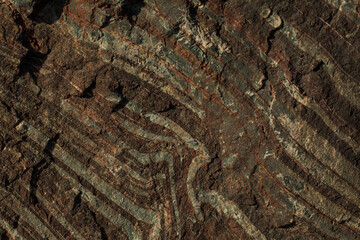 The texture of stone in a mining quarry. The natural appearance of stone extracted from the ground