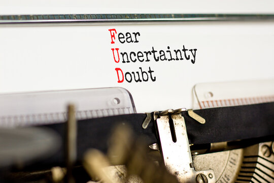 FUD fear uncertainty doubt symbol. Concept words FUD fear uncertainty doubt typed on old retro typewriter. Beautiful white background. Business and FUD fear uncertainty doubt concept. Copy space.