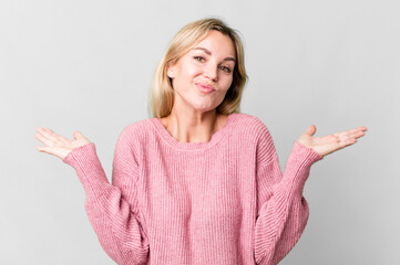 caucasian blonde woman feeling puzzled and confused and doubting