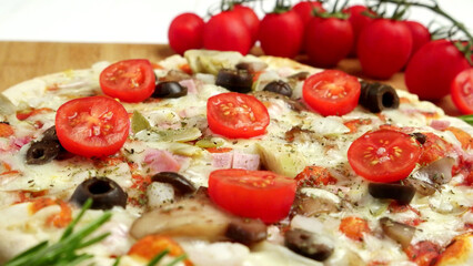 Pizza with bacon, olives and tomato