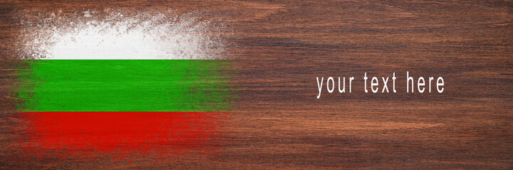 Flag of Bulgaria. Flag is painted on a wooden surface. Wooden background. Plywood surface. Copy space. Textured background