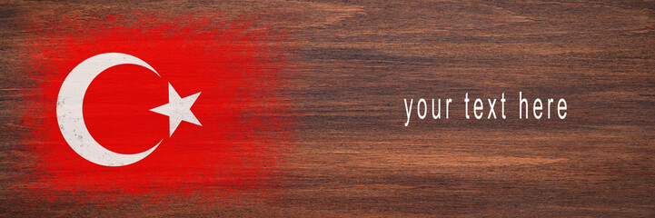 Flag of Turkey. Flag is painted on a wooden surface. Wooden background. Plywood surface. Copy space. Textured background