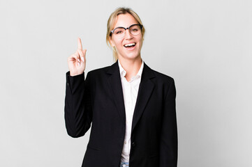 caucasian blonde woman feeling like a happy and excited genius after realizing an idea. business...