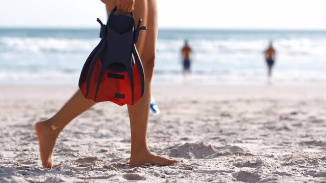 Diving, woman and walking on beach sand for summer vacation, freedom or travel adventure. Closeup girl with scuba diving equipment, snorkel and flippers at sea, sunshine or swimming in tropical ocean