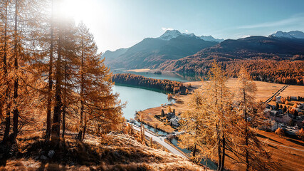 Amazing nature autumn scenery. Aerial Panoramic view of beautiful mountain valley in Alps with Lake...