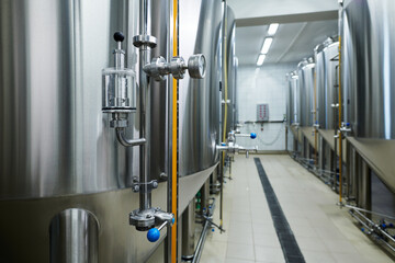 Obraz na płótnie Canvas Still tanks with barometer and valve in private brewery