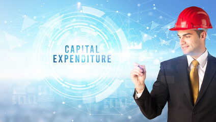 Handsome businessman with helmet drawing