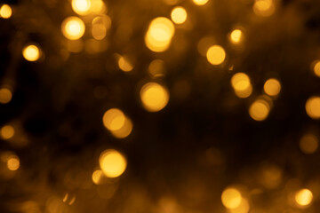 Abstract background of blurred yellow lights for design. Lights bokeh dis focus. Christmas background, copy space